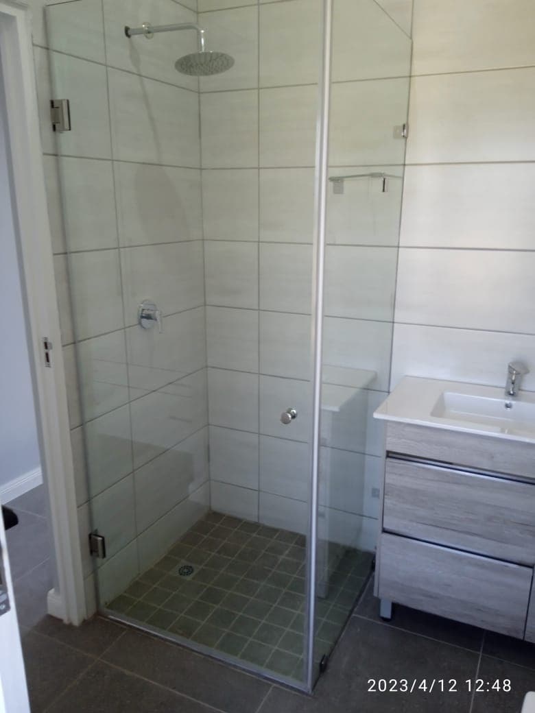Frameless glass shower enclosure luxury bathroom Johannesburg